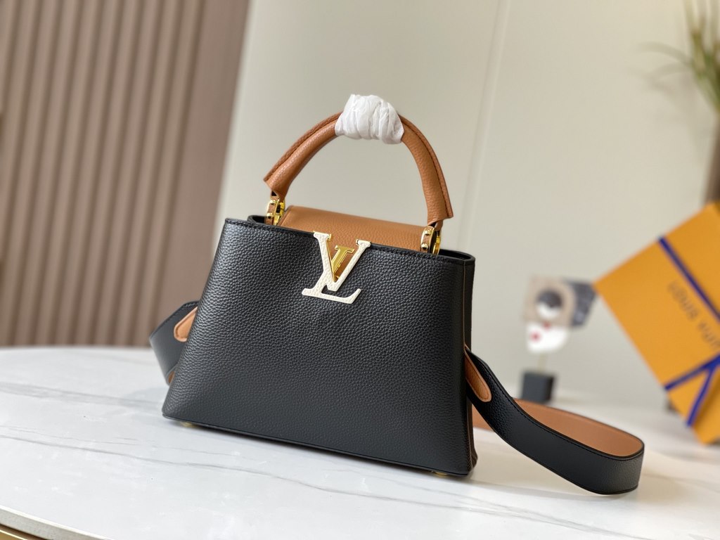 Exclusive -  M59464 Black with Almond Gold BuckleA modern clash of shades in full-grain cowhide leather, this small Capucines BB bag features the iconic LV alphabet and side loops, top handles and a detachable shoulder s