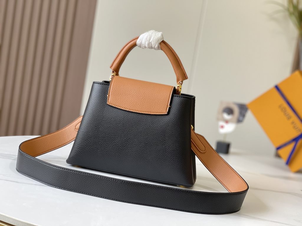 Exclusive -  M59464 Black with Almond Gold BuckleA modern clash of shades in full-grain cowhide leather, this small Capucines BB bag features the iconic LV alphabet and side loops, top handles and a detachable shoulder s