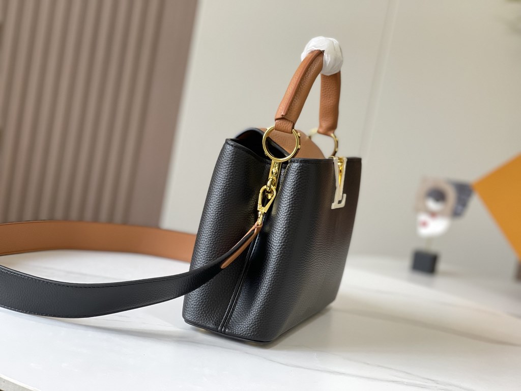 Exclusive -  M59464 Black with Almond Gold BuckleA modern clash of shades in full-grain cowhide leather, this small Capucines BB bag features the iconic LV alphabet and side loops, top handles and a detachable shoulder s