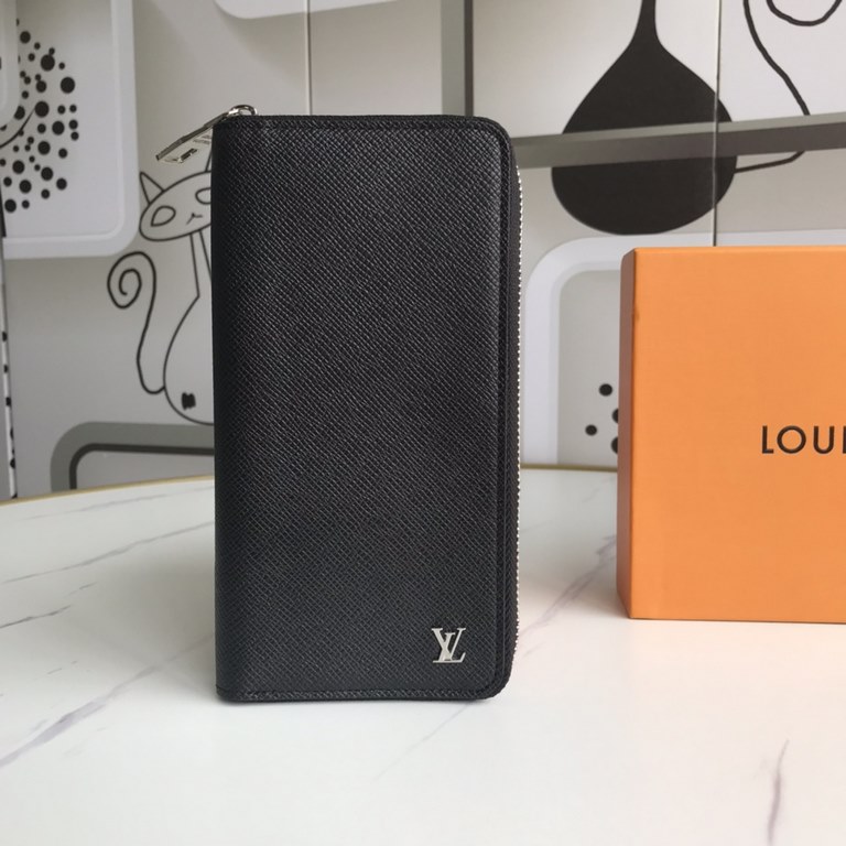 The  M63095 Zippy Vertical wallet hides functional details beneath its sleek lines. The classic Taga leather is soft and durable, while the silver-tone metal LV logo symbolizes the Louis Vuitton family identity. With mul