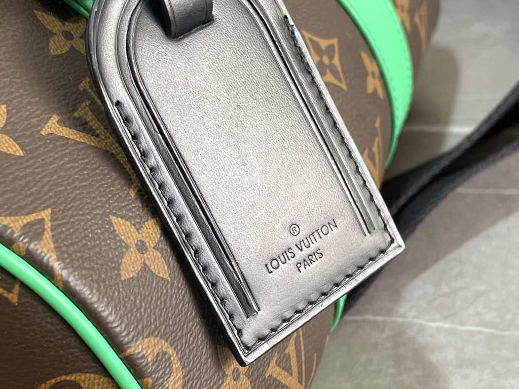 Exclusive to M20900, Louis Vuitton's iconic Keepall collection, the Monogram Macassar canvas is dipped in one of Virgil Abloh's signature brights, while the reinforced side straps and removable leather name tag continue 