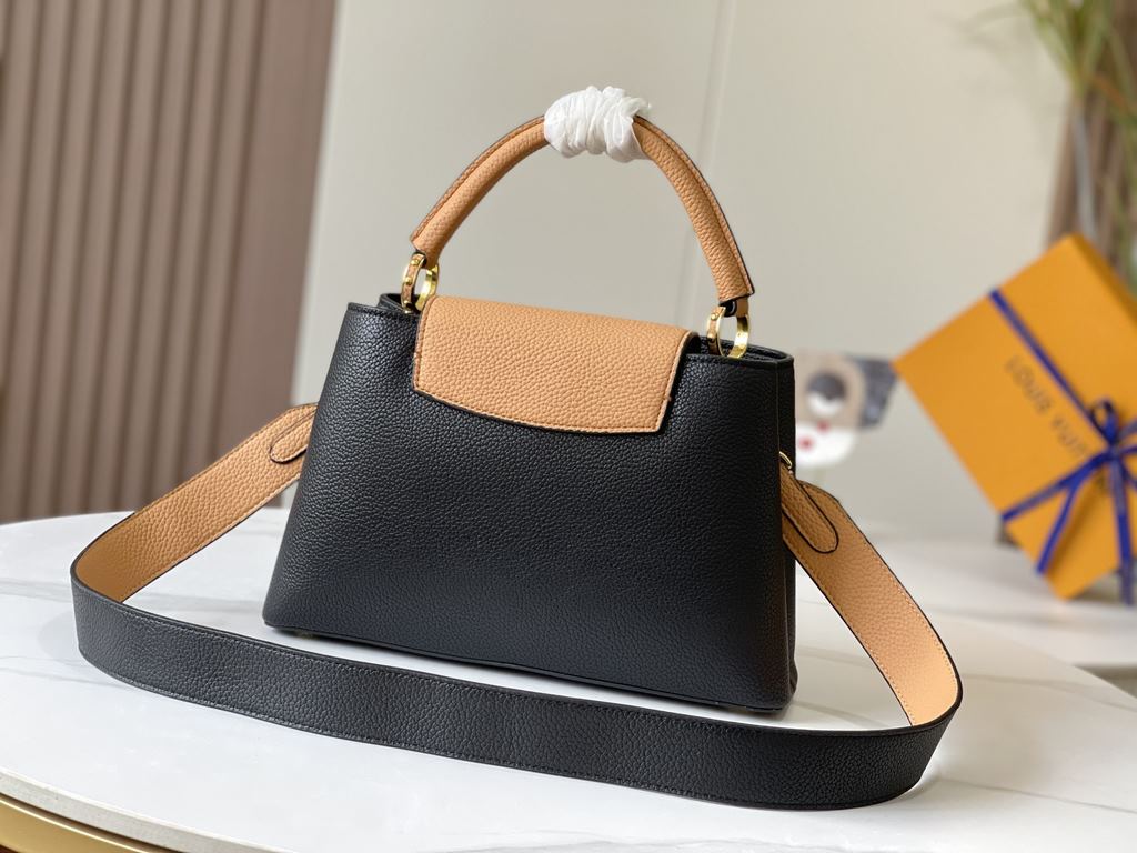 Exclusive -  M59466 Black with Almond Gold BuckleA modern clash of shades in full-grain cowhide leather, this medium Capucines bag features the iconic LV alphabet and side loops, top handles and a detachable shoulder str