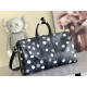 The M46400 LV x YK Keepall 45 travel bag from the Louis Vuitton x Yayoi Kusama collaboration celebrates the fusion of artistic creativity and craftsmanship with polka dots on Monogram Eclipse canvas, once again making it