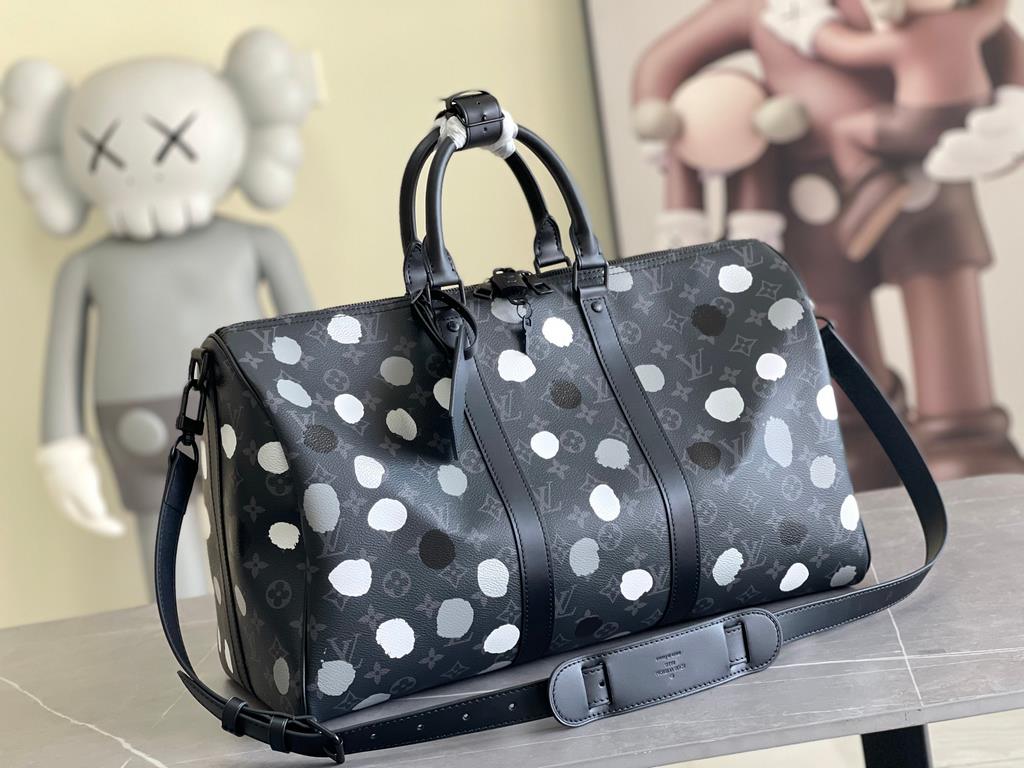 The M46400 LV x YK Keepall 45 travel bag from the Louis Vuitton x Yayoi Kusama collaboration celebrates the fusion of artistic creativity and craftsmanship with polka dots on Monogram Eclipse canvas, once again making it