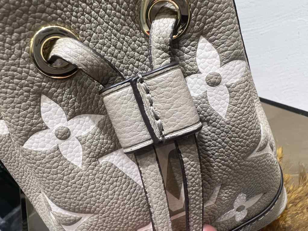 M46291 Grey Grams This Nano Noé bag is printed and embossed in leather with LV's alphabet and Monogram florals for an eye-catching look that will captivate the eye. Plenty of room for your daily needs, with an adjustable