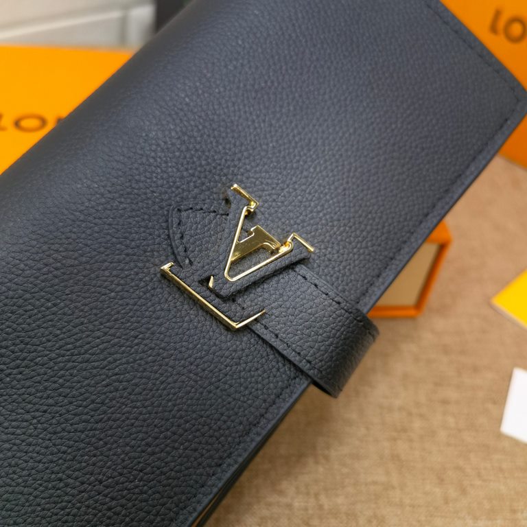 This LV Vertical wallet in soft grained Taurillon leather with a sliding closure embellished with LV letters is inspired by the Capucines handbag design.M81330Black BlueM81367Light CurryFull leatherLychee grain bedazzled