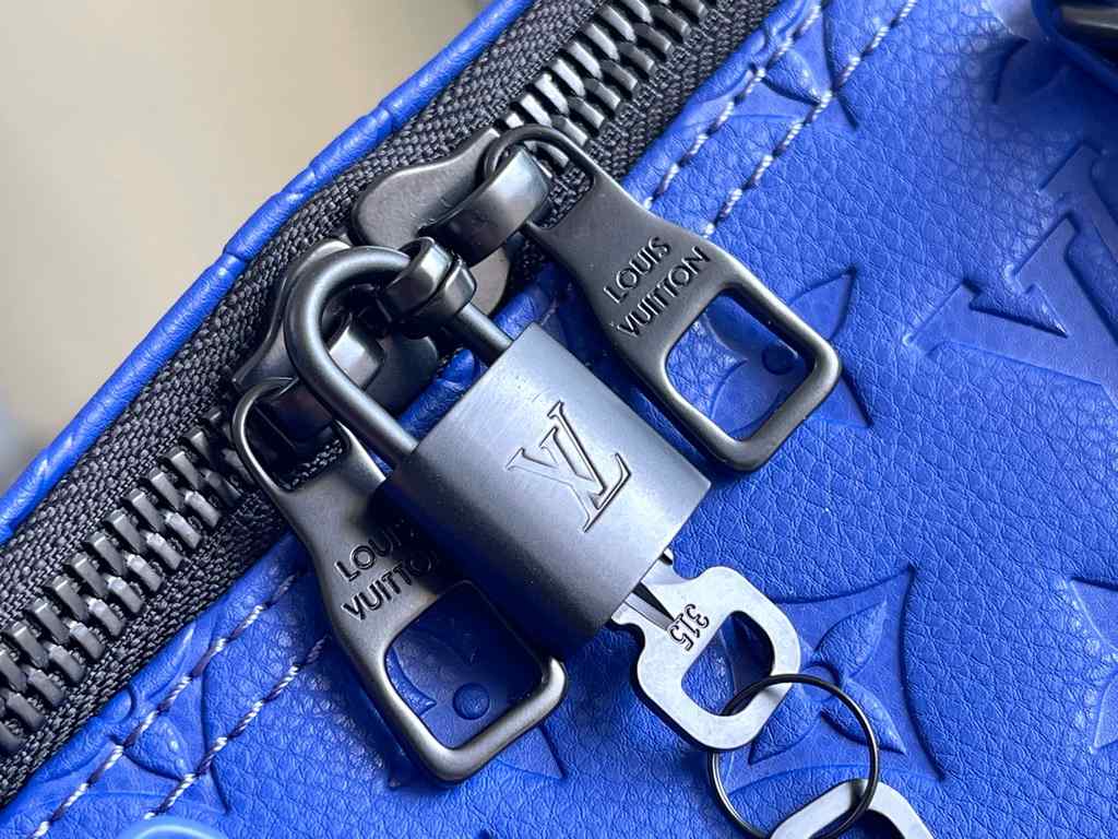 Top Original M23141 Indigo (Embossed) Full Leather Travel Bag Collection Keepall Bandoulière 50 Travel Bag One of Louis Vuitton's iconic travel bags, the Keepall Bandoulière 50 Travel Bag is a tough, embossed Taurillon l