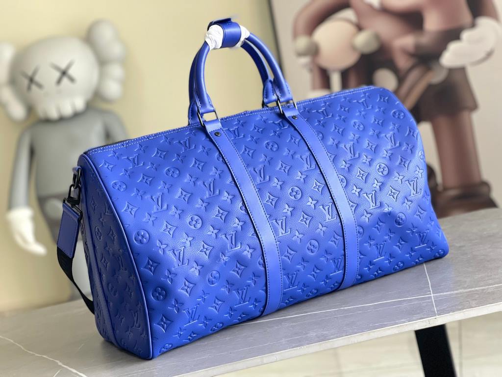 Top Original M23141 Indigo (Embossed) Full Leather Travel Bag Collection Keepall Bandoulière 50 Travel Bag One of Louis Vuitton's iconic travel bags, the Keepall Bandoulière 50 Travel Bag is a tough, embossed Taurillon l