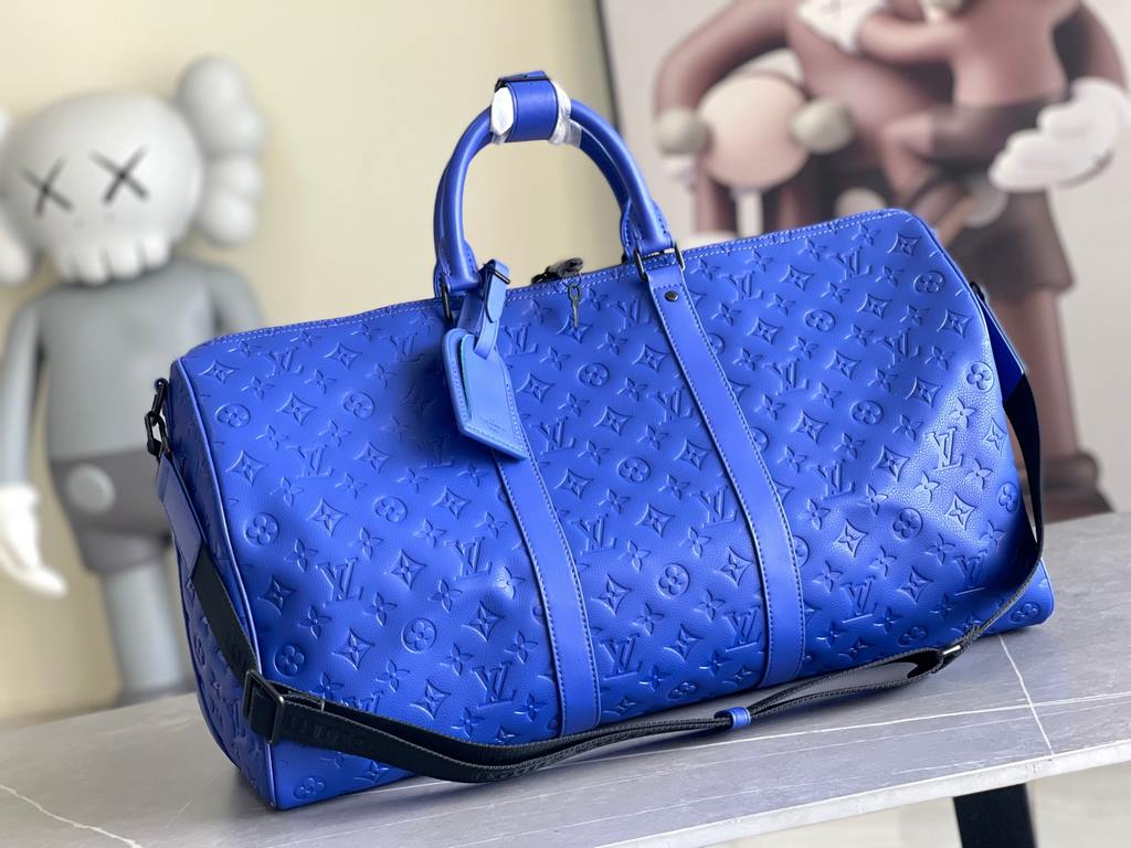 Top Original M23141 Indigo (Embossed) Full Leather Travel Bag Collection Keepall Bandoulière 50 Travel Bag One of Louis Vuitton's iconic travel bags, the Keepall Bandoulière 50 Travel Bag is a tough, embossed Taurillon l