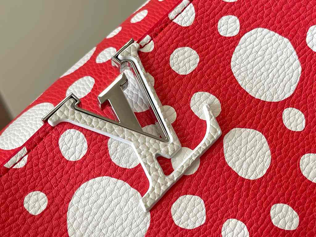 EXCLUSIVE SHOOTING - M21665 From the Louis Vuitton x YK Capucines collaboration, this medium-sized LV x Yayoi Kusama bag is a dazzling expression of the famous Japanese artist's childhood obsession with polka dots as a s