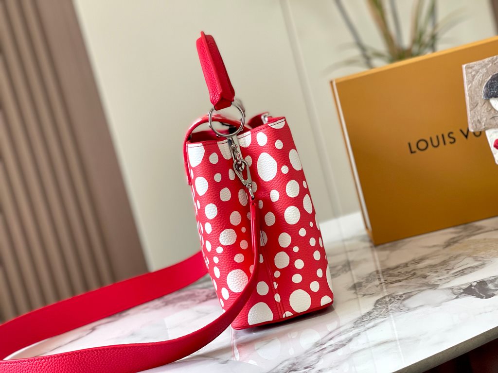 EXCLUSIVE SHOOTING - M21665 From the Louis Vuitton x YK Capucines collaboration, this medium-sized LV x Yayoi Kusama bag is a dazzling expression of the famous Japanese artist's childhood obsession with polka dots as a s