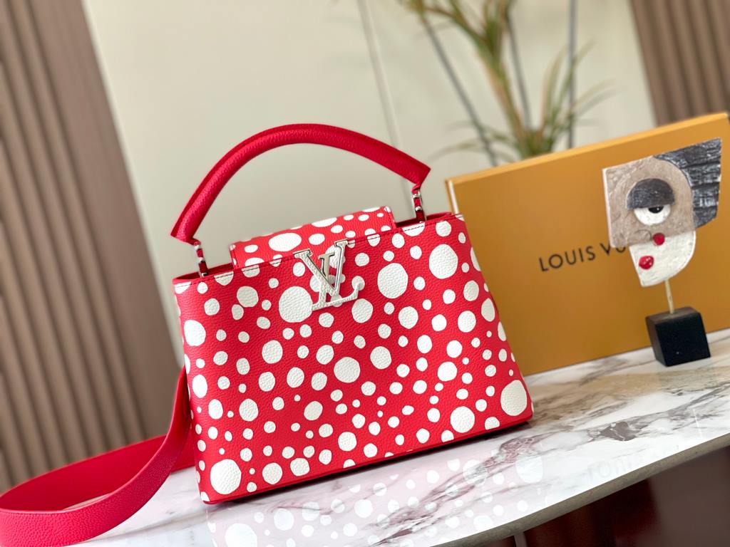 EXCLUSIVE SHOOTING - M21665 From the Louis Vuitton x YK Capucines collaboration, this medium-sized LV x Yayoi Kusama bag is a dazzling expression of the famous Japanese artist's childhood obsession with polka dots as a s