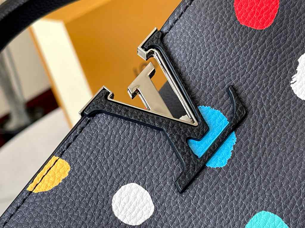 EXCLUSIVE SHOOTING - M21665 From the Louis Vuitton x YK Capucines collaboration, this medium-sized LV x Yayoi Kusama bag is a dazzling expression of the famous Japanese artist's childhood obsession with polka dots as a s