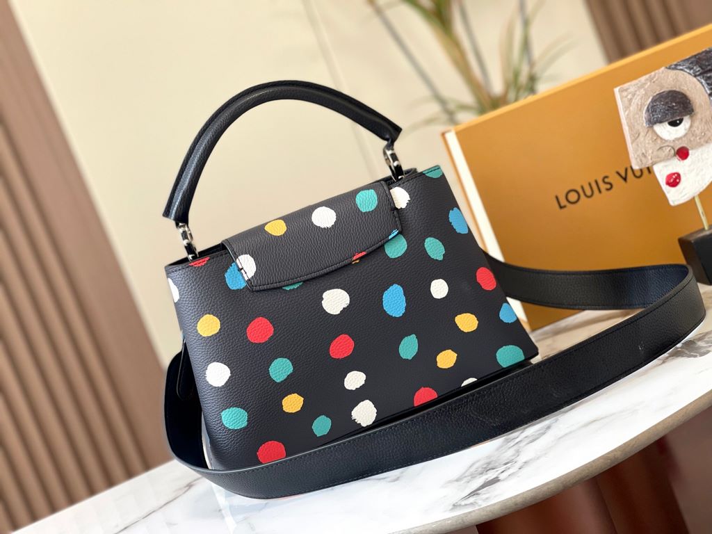 EXCLUSIVE SHOOTING - M21665 From the Louis Vuitton x YK Capucines collaboration, this medium-sized LV x Yayoi Kusama bag is a dazzling expression of the famous Japanese artist's childhood obsession with polka dots as a s