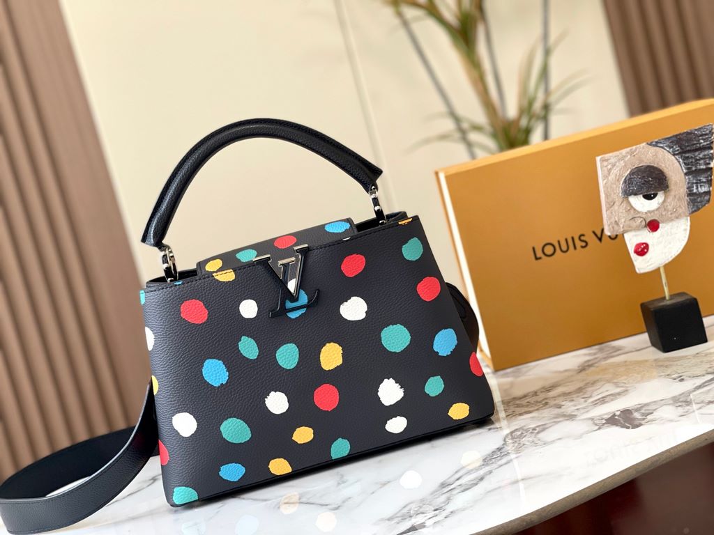 EXCLUSIVE SHOOTING - M21665 From the Louis Vuitton x YK Capucines collaboration, this medium-sized LV x Yayoi Kusama bag is a dazzling expression of the famous Japanese artist's childhood obsession with polka dots as a s