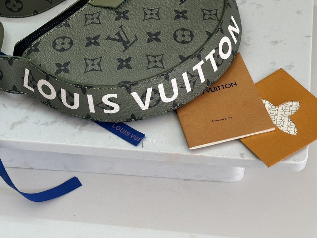 Model No. M23838 Green   This LV Moon Crossbody is made from supple coated canvas for a minimalist design, with an on-trend colorful lining and bold Louis Vuitton lettering. The half-moon silhouette flatters your body an