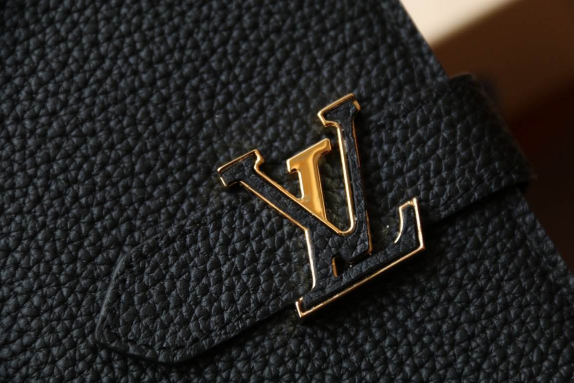 M81330This LV Vertical walletInspired by Capucines handbags, this wallet in soft grained Taurillon leather is embellished with LV letters for the sliding closure. It opens to reveal a color-blocked lining and features a 