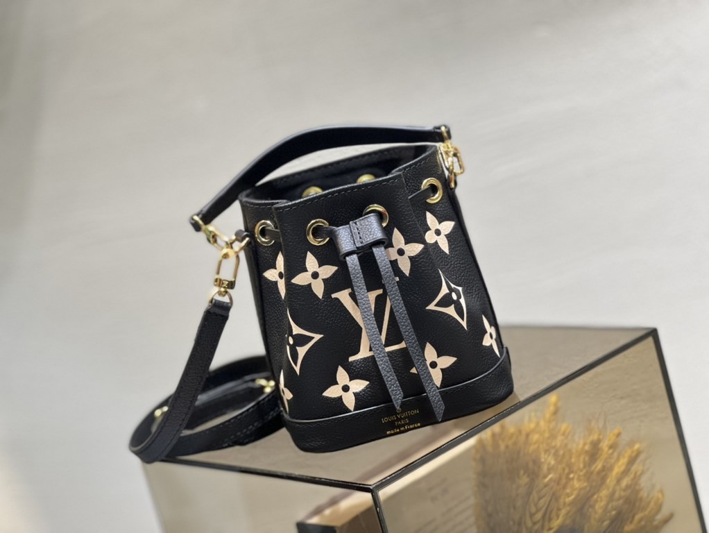 M46291 Grey Grams This Nano Noé bag is printed and embossed in leather with LV's alphabet and Monogram florals for an eye-catching look that will captivate the eye. Plenty of room for your daily needs, with an adjustable