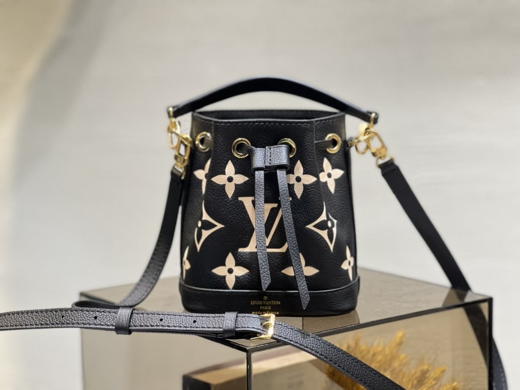 M46291 Grey Grams This Nano Noé bag is printed and embossed in leather with LV's alphabet and Monogram florals for an eye-catching look that will captivate the eye. Plenty of room for your daily needs, with an adjustable