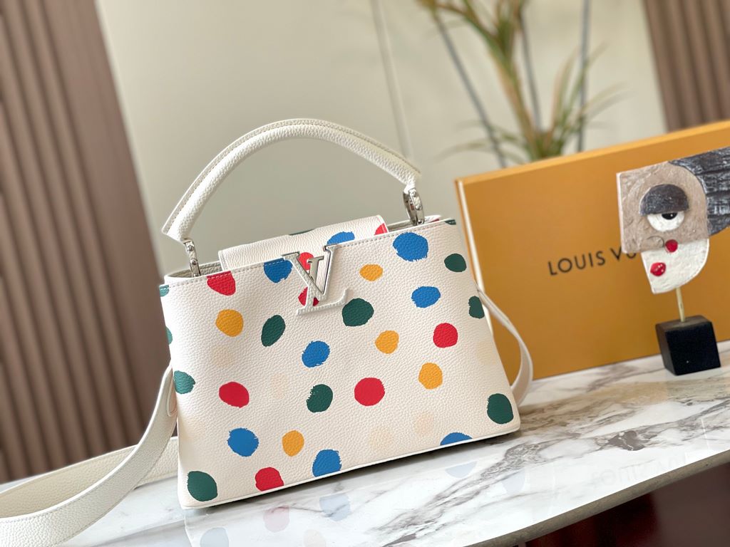 EXCLUSIVE SHOOTING - M21665 From the Louis Vuitton x YK Capucines collaboration, this medium-sized LV x Yayoi Kusama bag is a dazzling expression of the famous Japanese artist's childhood obsession with polka dots as a s