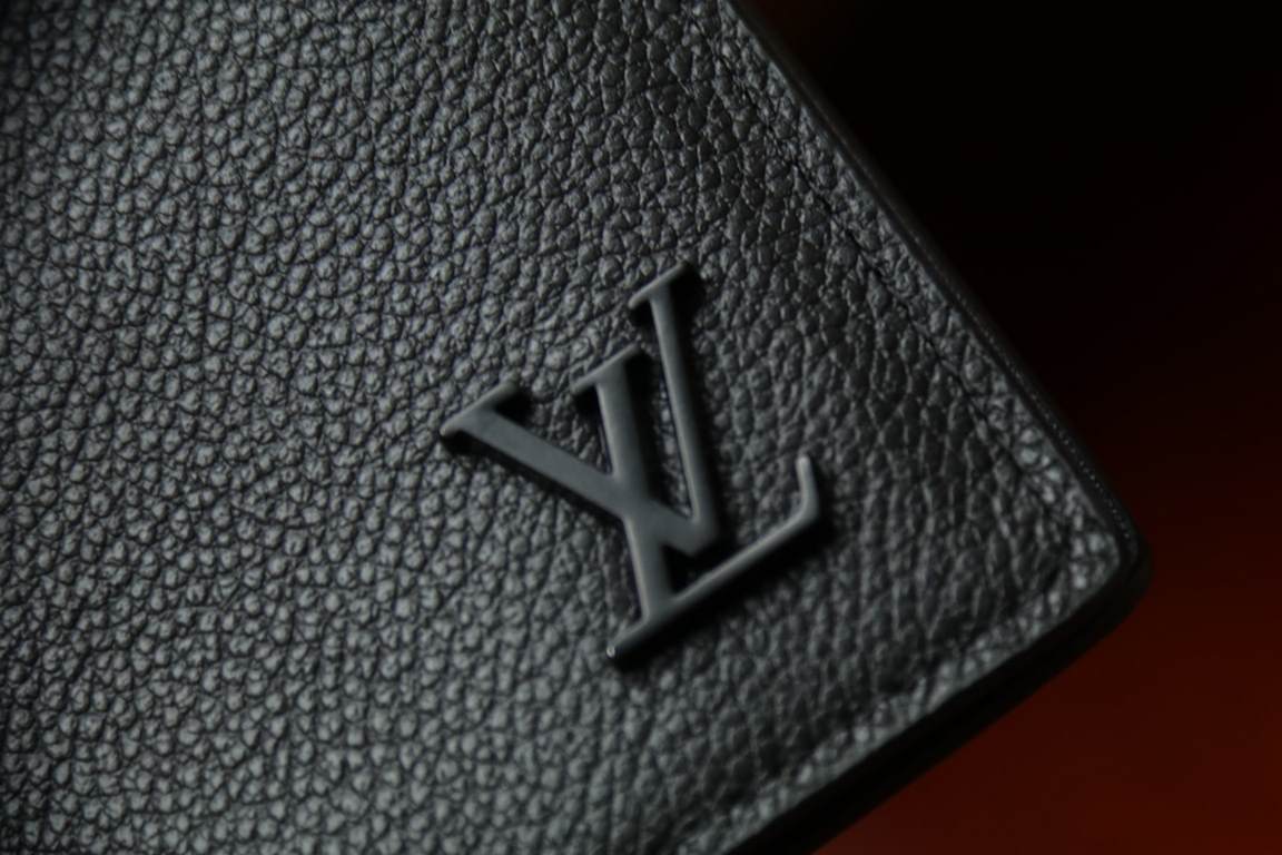 M69980New Aerogram Brazza WalletThe grained calfskin leather is emphasized with a discreet metallic LV lettering. The compartments and card slots hold bills, documents and coins, making it ideal for use with the LV Aerog