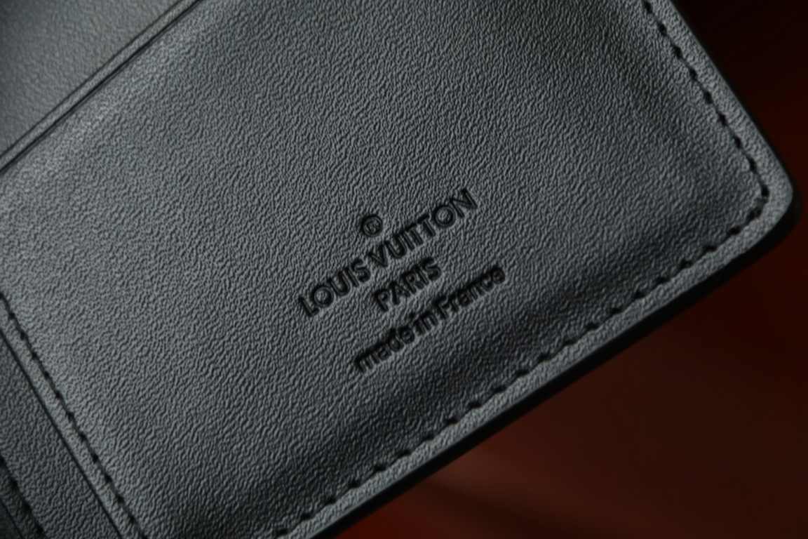 M69980New Aerogram Brazza WalletThe grained calfskin leather is emphasized with a discreet metallic LV lettering. The compartments and card slots hold bills, documents and coins, making it ideal for use with the LV Aerog