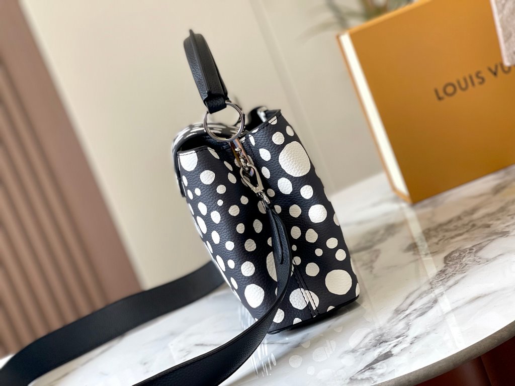 EXCLUSIVE SHOOTING - M21663 From the Louis Vuitton x Yayoi Kusama collaboration comes this LV x YK Capucines pouch. The renowned Japanese artist's childhood obsession with polka dots as a symbol of infinity finds dazzlin