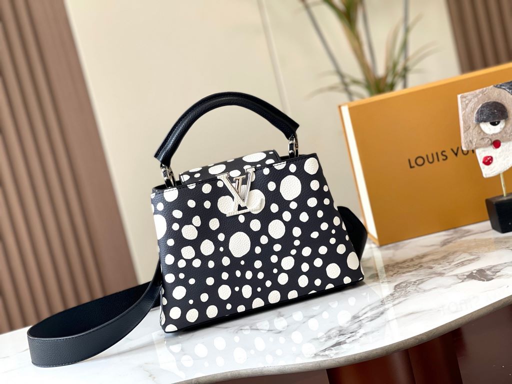 EXCLUSIVE SHOOTING - M21663 From the Louis Vuitton x Yayoi Kusama collaboration comes this LV x YK Capucines pouch. The renowned Japanese artist's childhood obsession with polka dots as a symbol of infinity finds dazzlin