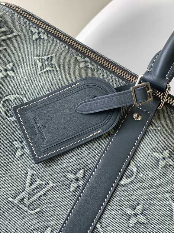 ￥  Top Original M22532 Denim This Keepall Bandoulière 50 travel bag is embossed with a Monogram pattern in faded denim, reinventing one of Louis Vuitton's classic designs. The reinforced side straps and top handle are ma