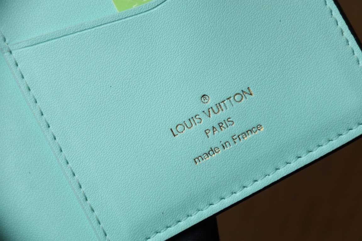 M81330This LV Vertical walletInspired by Capucines handbags, this wallet in soft grained Taurillon leather is embellished with LV letters for the sliding closure. It opens to reveal a color-blocked lining and features a 