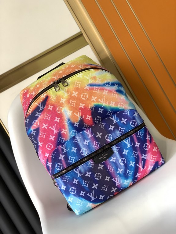 Top Original  M45760This Discovery duffel bag in aurora borealis Monogram floral and LV letters takes a cue from the classic design of the collegiate style backpacks and features an iPad pocket. Adjustable leather should