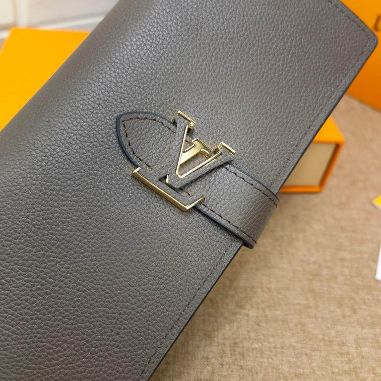 This LV Vertical wallet in soft grained Taurillon leather with a sliding closure embellished with LV letters is inspired by the Capucines handbag design.M81330Black BlueM81367Light CurryFull leatherLychee grain bedazzled