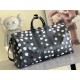 The M46401LV x YK Keepall 55 travel bag from the Louis Vuitton x Yayoi Kusama collaboration celebrates the fusion of artistic creativity and craftsmanship with polka dots on Monogram Eclipse canvas, once again making it 