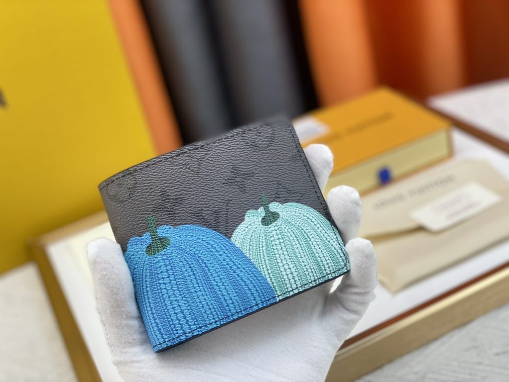 60895 Grey Flower Pumpkin   From the Louis Vuitton x Yayoi Kusama Collaboration, this LV x YK pocket wallet features a colorful pumpkin motif on Monogram Eclipse Reverse canvas, recreating the symbol of warmth and solace