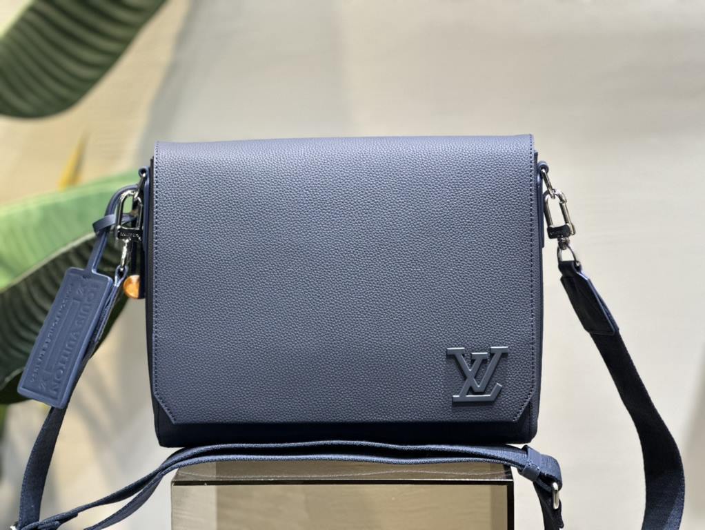 M21363Blue This messenger bag pays homage to Louis Vuitton's travel heritage with its LV Aerogram cowhide leather, which is as supple as the airmail stationery of yesteryear. The metal LV letters and jacquard shoulder st