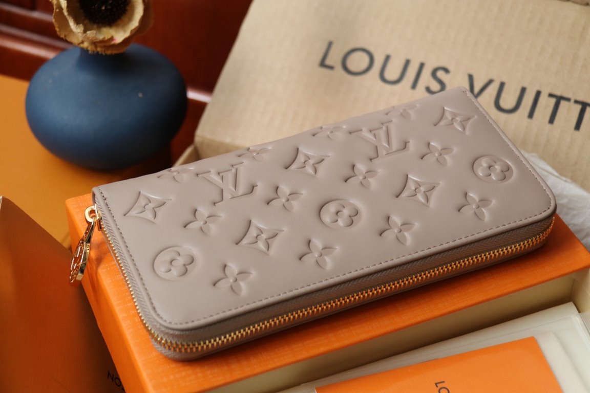 This Zipper WalletM81510Sewn in padded Monogram embossed lambskin, it complements the Coussin Leather Collection. Elegantly designed with a gold-tone zipper embellished with the LV Circle logo pull, the all-in-one wallet