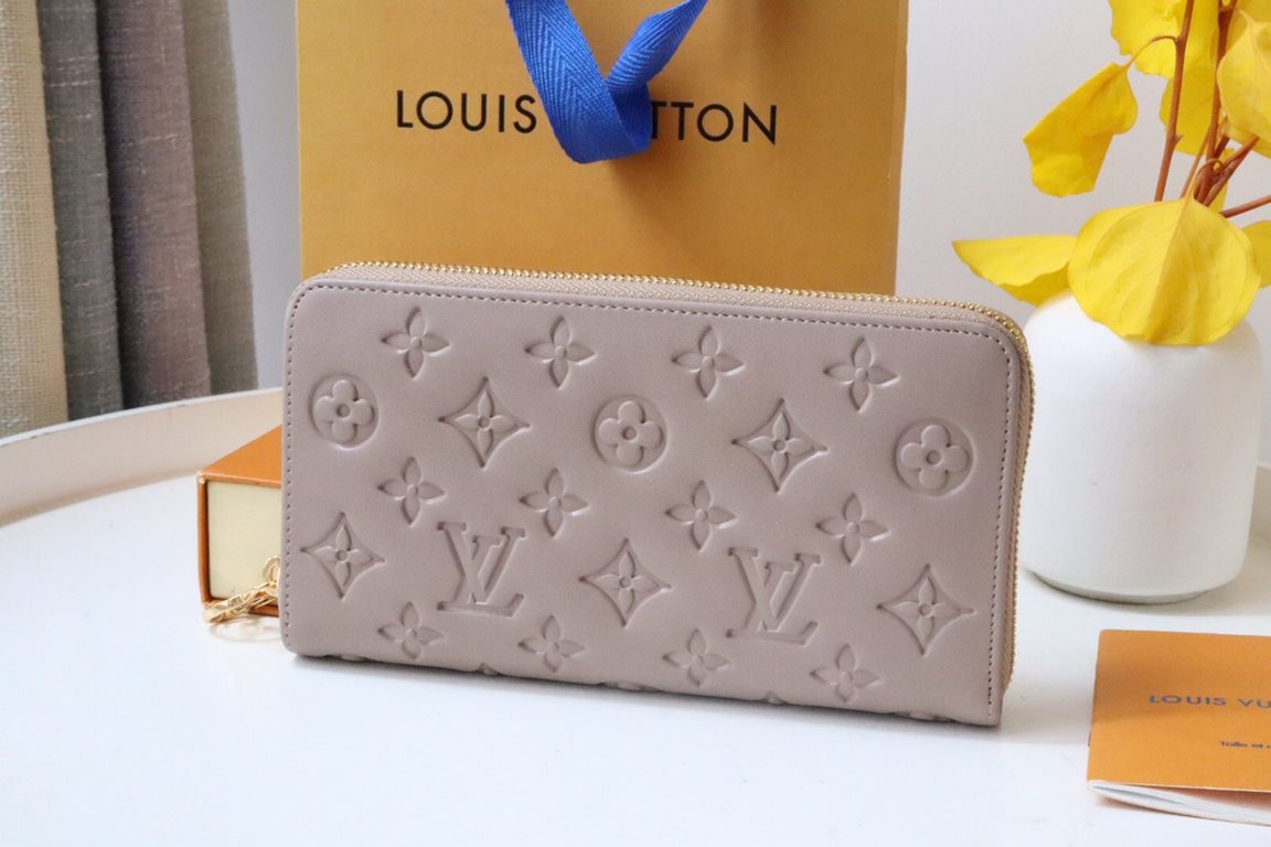 This Zipper WalletM81510Sewn in padded Monogram embossed lambskin, it complements the Coussin Leather Collection. Elegantly designed with a gold-tone zipper embellished with the LV Circle logo pull, the all-in-one wallet