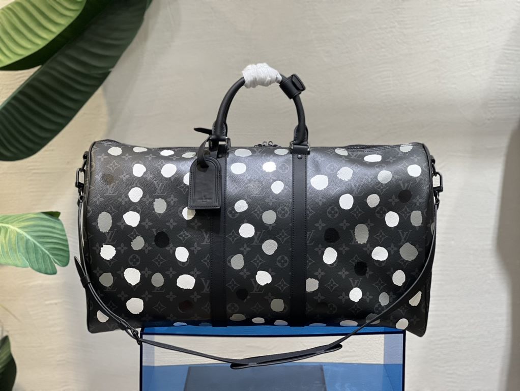 From the Louis Vuitton x Yayoi Kusama collaboration, the M46401 Louis Vuitton x YK Keepall 55 travel bag celebrates the fusion of artistic creativity and craftsmanship with polka dots on Monogram Eclipse canvas, once aga