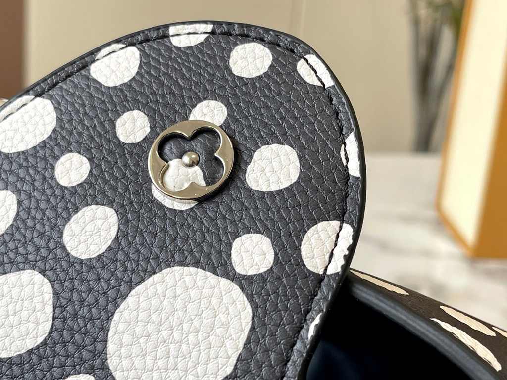 EXCLUSIVE SHOOTING - M21665 From the Louis Vuitton x YK Capucines collaboration, this medium-sized LV x Yayoi Kusama bag is a dazzling expression of the famous Japanese artist's childhood obsession with polka dots as a s