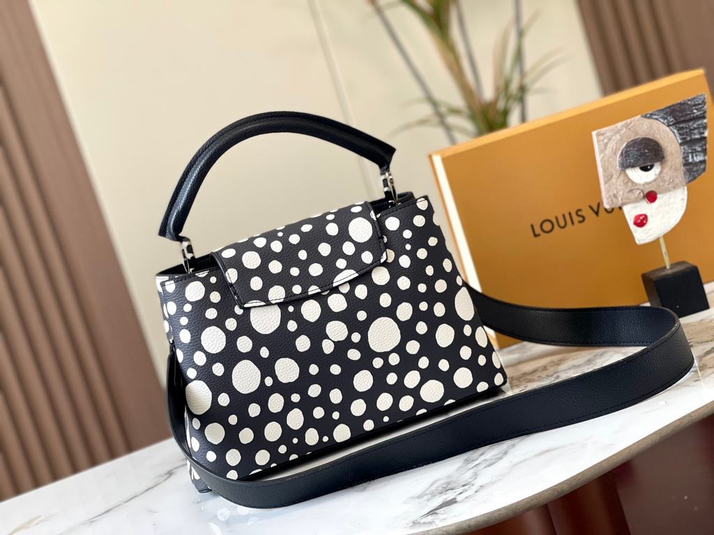 EXCLUSIVE SHOOTING - M21665 From the Louis Vuitton x YK Capucines collaboration, this medium-sized LV x Yayoi Kusama bag is a dazzling expression of the famous Japanese artist's childhood obsession with polka dots as a s