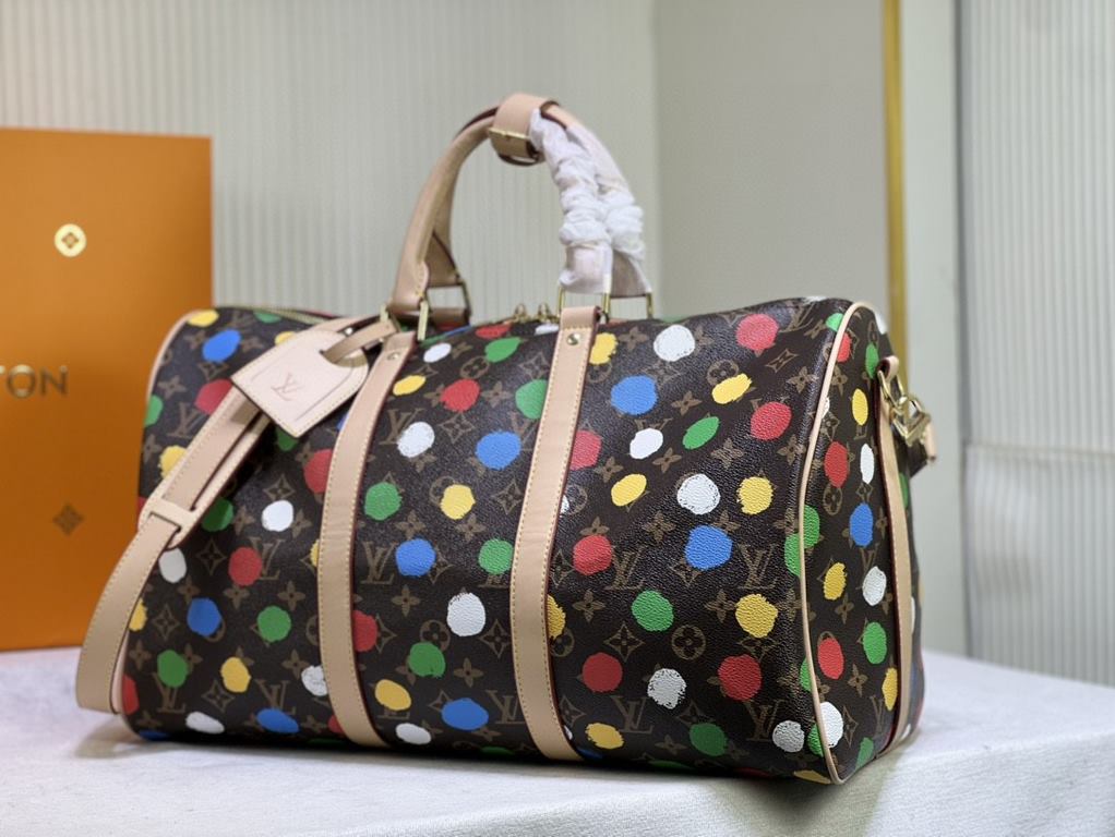 M46400 46377 41416 From the Louis Vuitton x Yayoi Kusama collaboration, the Louis Vuitton x Yayoi Kusama Keepall 45 travel bag celebrates the fusion of artistic creativity and craftsmanship with polka dots on Monogram Ec