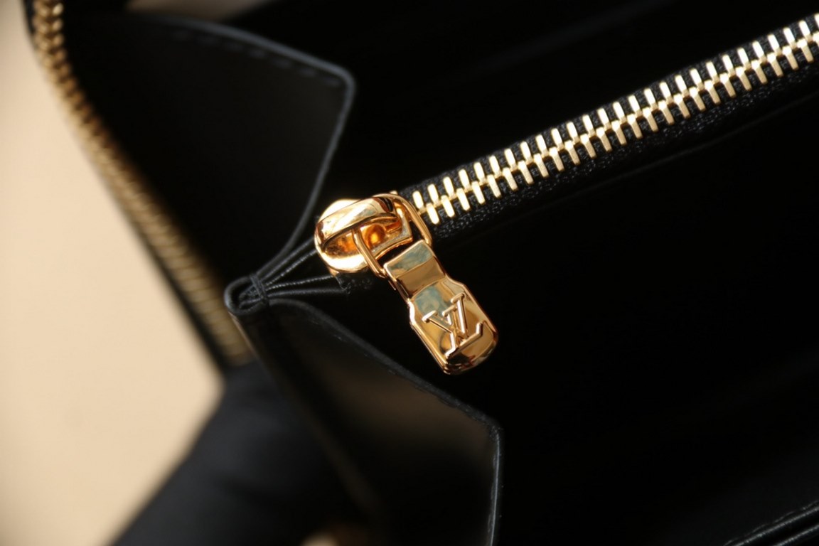 This Zipper WalletM81510Sewn in padded Monogram embossed lambskin, it complements the Coussin Leather Collection. Elegantly designed with a gold-tone zipper embellished with the LV Circle logo pull, the all-in-one wallet