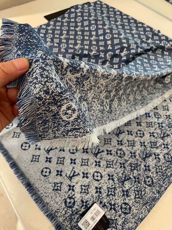 Pricelv2023's newest shawl has a gradient effect that resembles the chic texture of beloved jeans washed over time. The gorgeous silk-wool blend is cut to a generous size for a variety of styling possibilities. The      