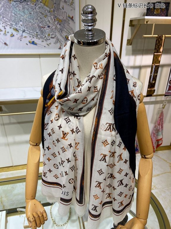 Price.   Donkey family new [V chain logo long scarf] cashmere long scarf, show LV letters in the classic Monogram pattern of dexterity changes, floral elements intertwined arrangement, embellished tassel trim. This size 