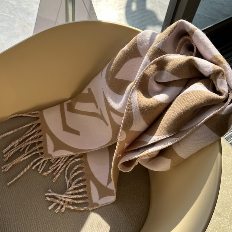 The  23 Medallion Scarf from Donkey Kong is a classic monogrammed scarf with large letters and a Monogram floral pattern, trimmed with long tassels for a touch of flamboyant texture. Wrapped in wool, the scarf will keep 