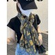 The new Lv print with the classic Monogram pattern and many of Louis Vuitton's signature design elements give this new scarf an enduring fashionable appeal. This scarf will add a touch of sophistication to a classic or t