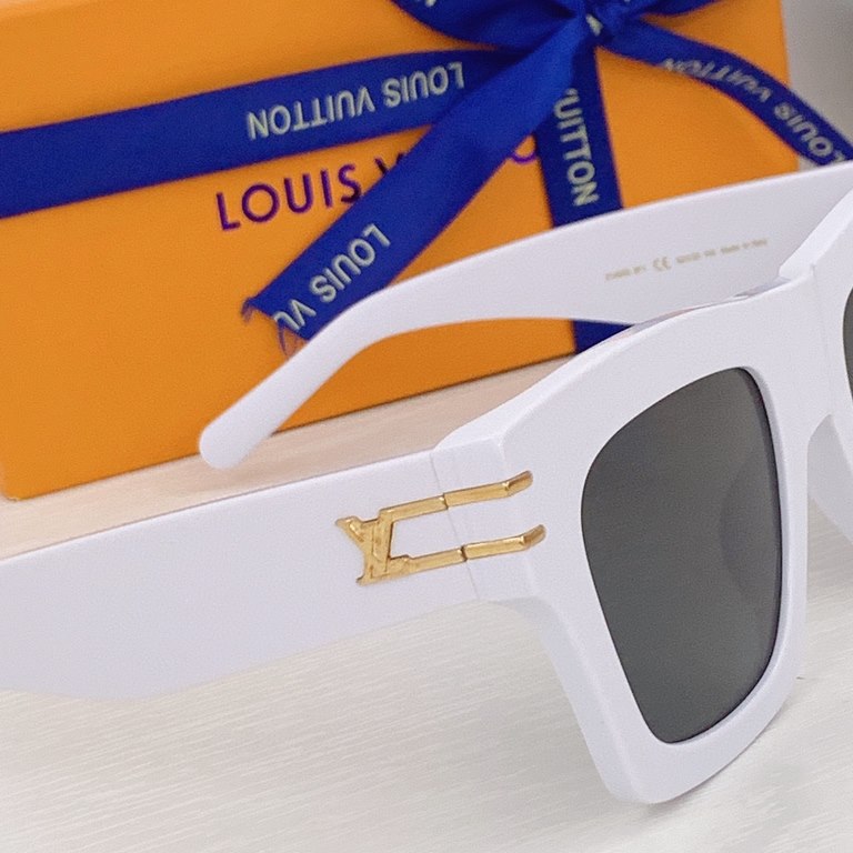 LV Blade Model No. 1482 Sunglasses are crafted in a timeless, rugged square design with articulation embellished with dazzling LV letters, Monogram florals at the headband and the LV Circle logo on the lenses. Highly rec