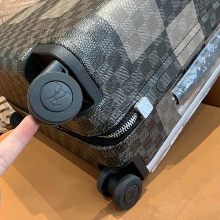 Tapping into the creative potential of the brand's classic Damier canvas, the new Horizon luggage features the Damier Graphite Giant pattern in varying shades of plaid in different sizes, with flexible dual wheels and a 