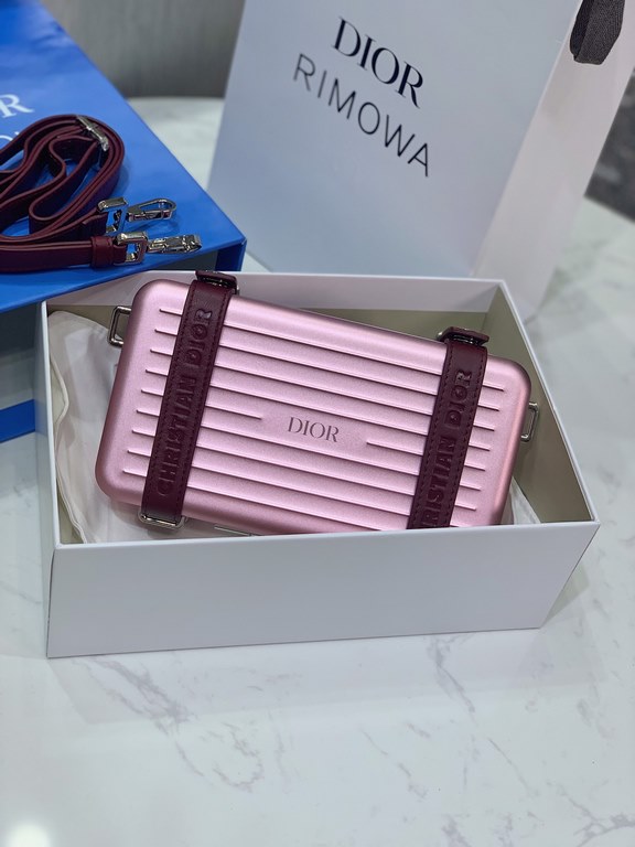 DIR X RIMOWA Capsule Collaboration CollectionUltra Limited EditionA lot of goodwill  My heart  Small but very  lovely. Super practical,Total  3 compartments. The size of a handbag.It can definitely fit an Iphone proMax [