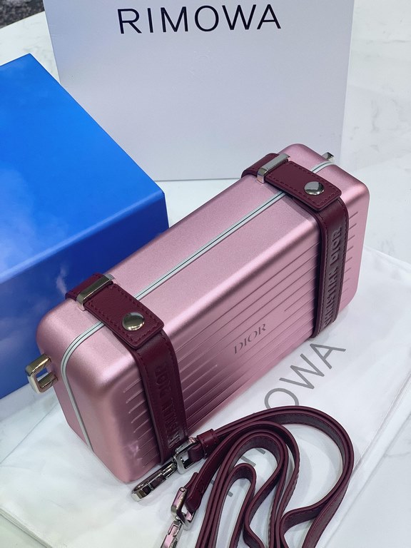 DIR X RIMOWA Capsule Collaboration CollectionUltra Limited EditionA lot of goodwill  My heart  Small but very  lovely. Super practical,Total  3 compartments. The size of a handbag.It can definitely fit an Iphone proMax [